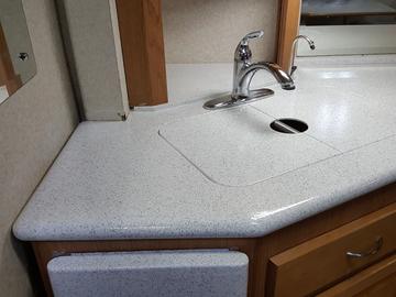 Corian countertop after repair and refinish with Stone Accent Finish 